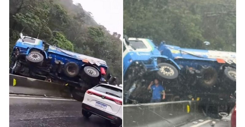 Caminhão fica atravessado em mureta de proteção, interdita faixas e trava o trânsito na BR-101, no Morro dos Cavalos